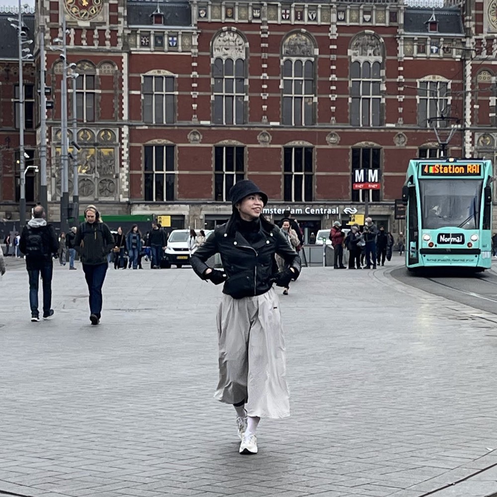 Spring walking in front of Amsterdam’s central station